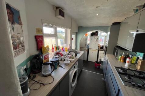 A spacious kitchen with abundant natural light,...