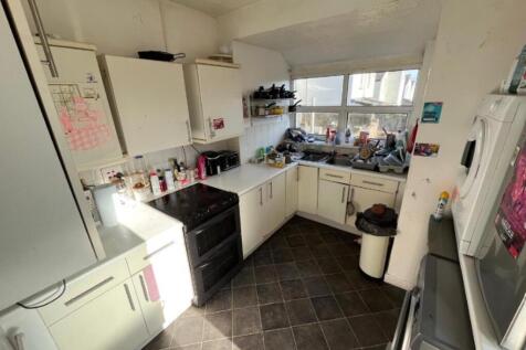 A cozy kitchen space with ample natural light, ...