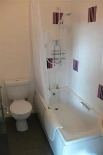 A clean and functional bathroom featuring a bat...