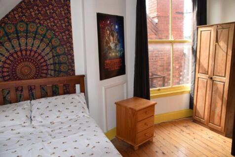 A bright and inviting double bedroom featuring ...