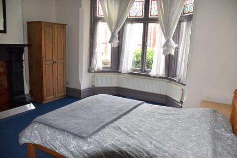 A bright and inviting double bedroom featuring ...