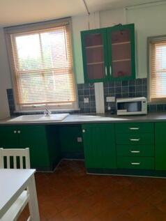 A bright and tidy kitchenette featuring stylish...