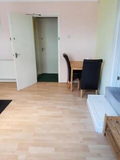 A welcoming hallway with ample space and natura...