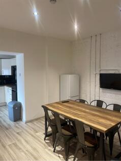 Spacious communal lounge area featuring a large...