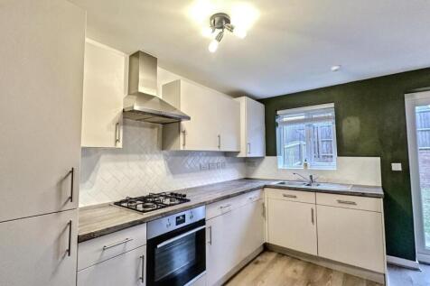 A modern and spacious kitchen with ample storag...