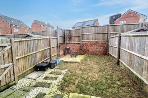 A spacious garden area perfect for outdoor rela...