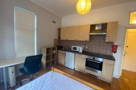 A modern kitchenette with ample space and natur...