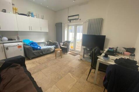 A spacious living room with good natural light ...