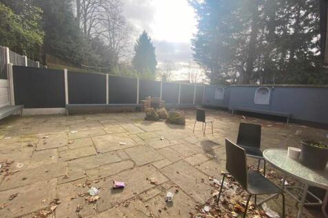 A spacious garden area with ample seating, perf...