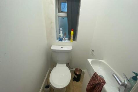 A compact and functional single toilet with ess...