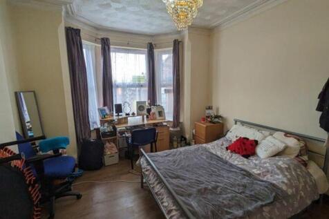 A bright and inviting double bedroom featuring ...