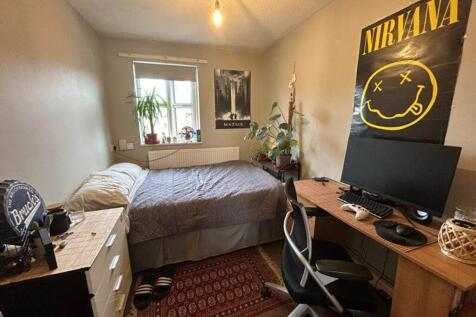 A cozy double bedroom with stylish decor, suita...