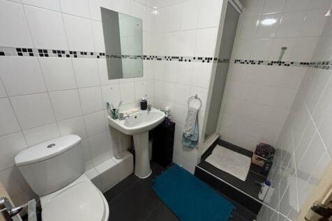 A well-maintained bathroom featuring modern fix...