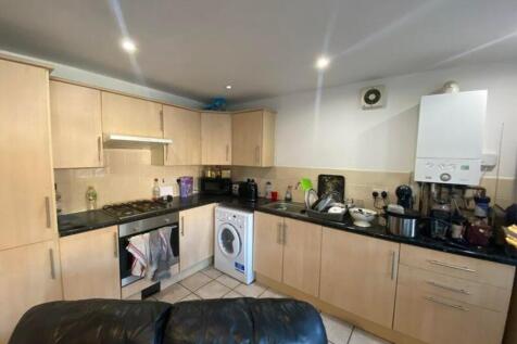 A functional kitchenette with modern appliances...