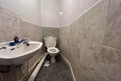 A compact single toilet featuring modern finish...