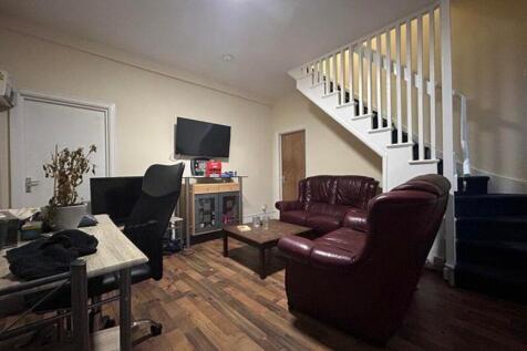 A cozy living room with a welcoming atmosphere,...