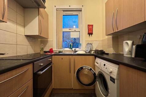 A cozy kitchenette with essential appliances, p...