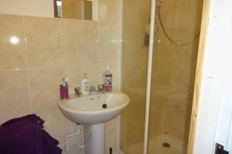 A tidy bathroom featuring a shower, perfect for...