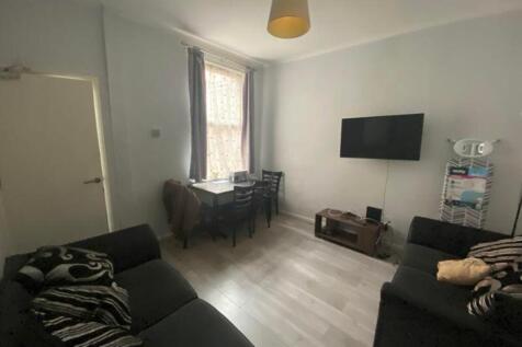 A spacious and inviting modern living room with...