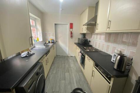 A modern and functional kitchen featuring ample...
