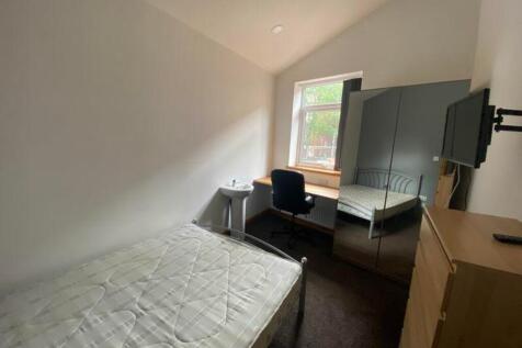 A bright and tidy double bedroom featuring ampl...