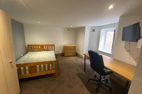 A spacious and inviting double bedroom, featuri...