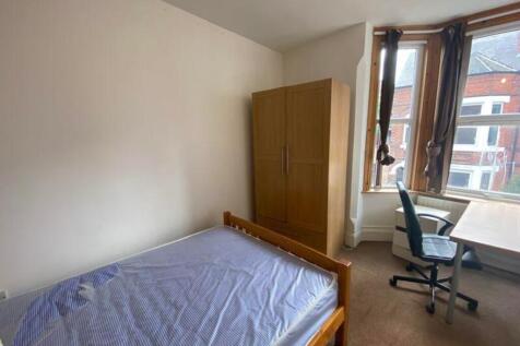 A bright and inviting double bedroom featuring ...