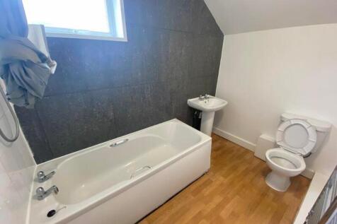 A bright and modern bathroom featuring a stylis...