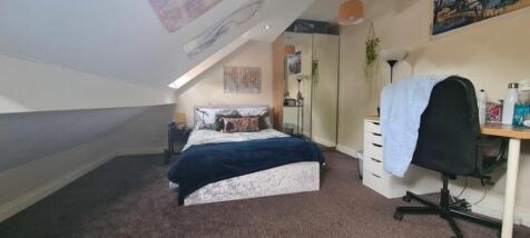 A spacious and inviting large double bedroom, p...