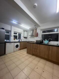 A spacious and functional kitchen with ample co...