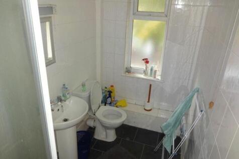 A functional and tidy bathroom with natural lig...