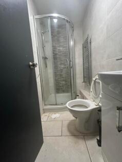 A modern bathroom featuring a sleek shower and ...