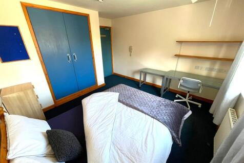 A bright and spacious double bedroom featuring ...