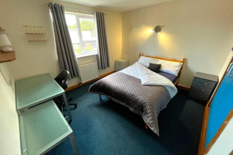 A bright and inviting double bedroom with ample...