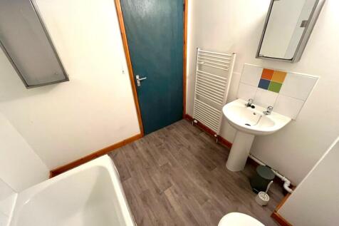 A bright and tidy bathroom featuring modern fix...