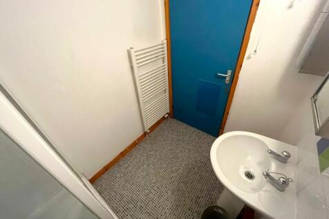 A tidy bathroom with modern fixtures and good l...