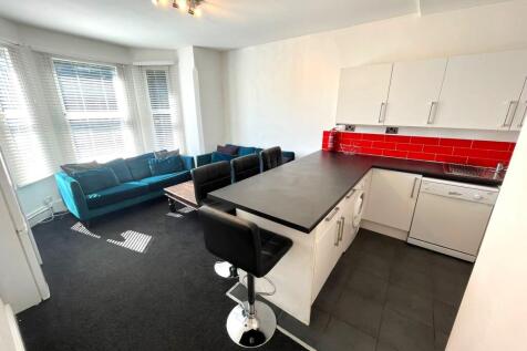 A spacious and inviting large modern living roo...