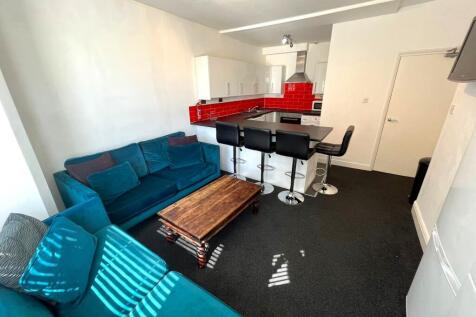 A bright and inviting large modern living room ...