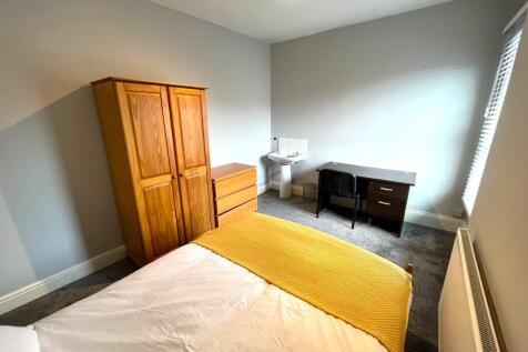A bright and inviting double bedroom featuring ...