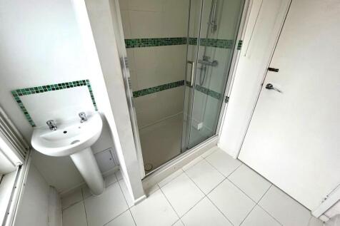 A bright and modern bathroom featuring a spacio...