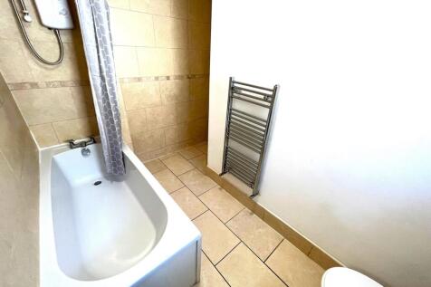 A tidy and well-maintained bathroom featuring a...