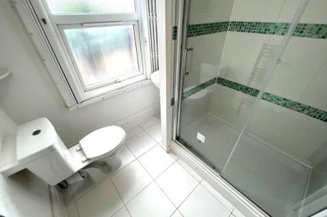 A bright and well-maintained bathroom featuring...