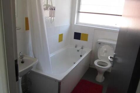 A clean and functional bathroom featuring a bat...