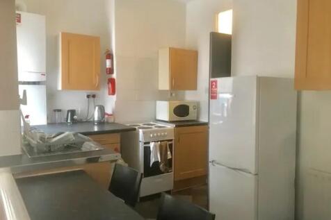 A bright and tidy kitchenette with modern appli...