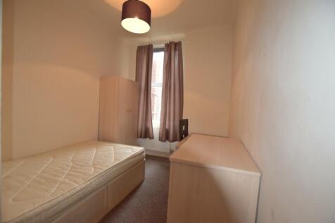 A bright and tidy double bedroom featuring a fi...