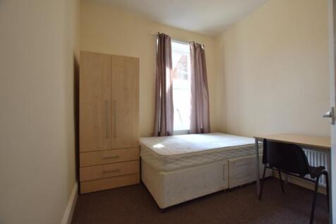 A bright and cozy double bedroom featuring a fi...