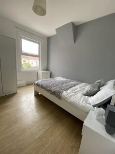 A bright and inviting double bedroom featuring ...