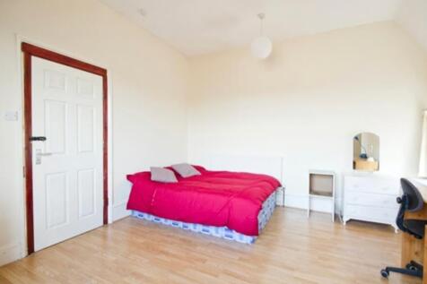 A bright and spacious double bedroom featuring ...