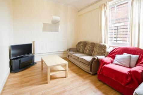 A bright and inviting living room with ample sp...