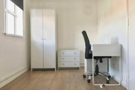Bright and spacious double bedroom featuring a ...